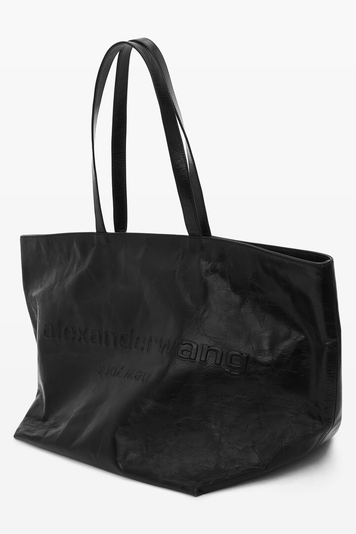 Black leather tote bag with textured logo