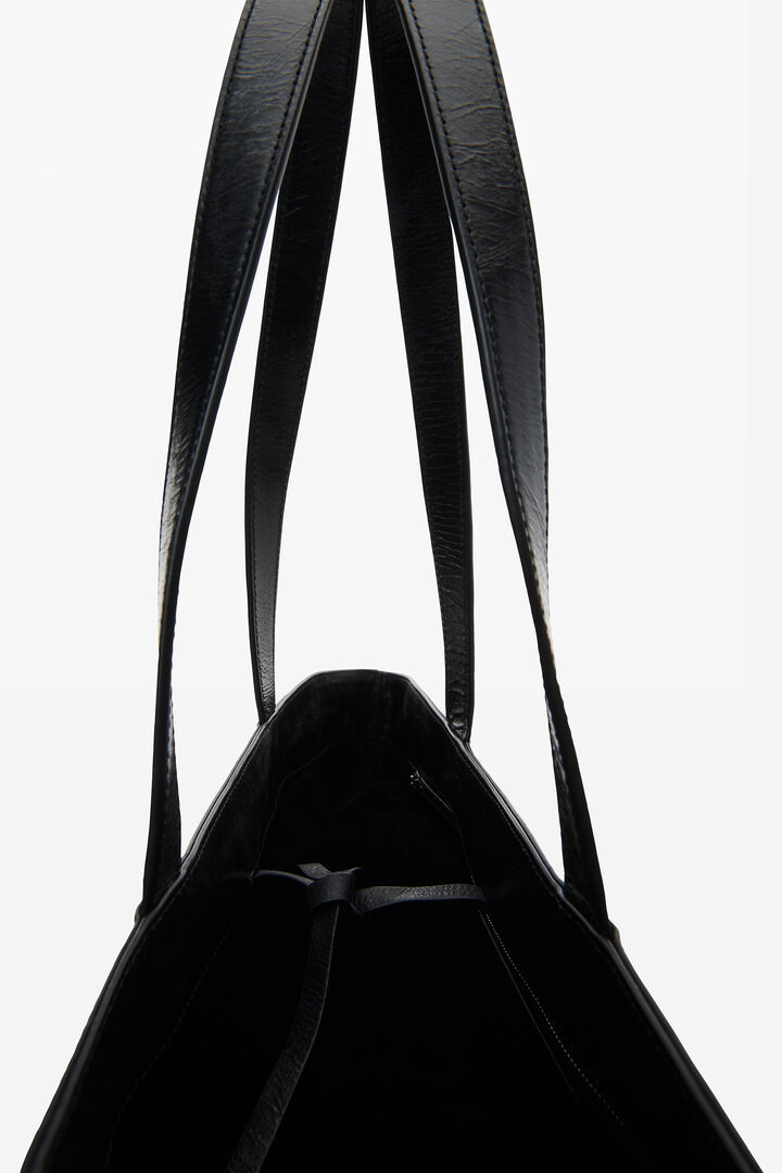 Black leather tote bag with textured logo